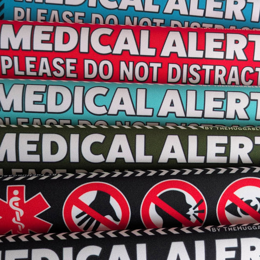 54. "MEDICAL ALERT, please do not distract". Plus signs on the other side. Leash sleeves.