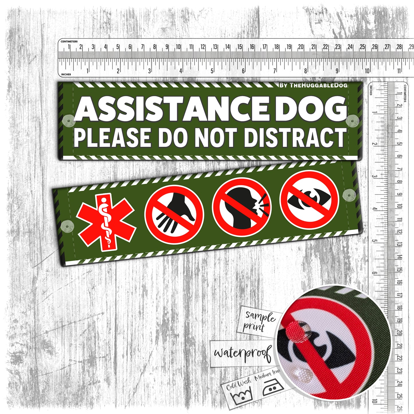 "ASSISTANCE DOG, please do not distract". Plus signs on the other side. Leash sleeves.