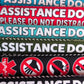 "ASSISTANCE DOG, please do not distract". Plus signs on the other side. Leash sleeves.