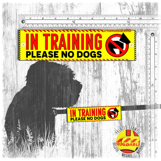 "In training, please NO DOGS". Alert leash sleeves for dogs.